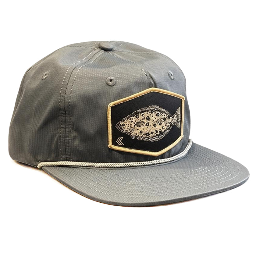 A gray unstructured baseball cap with a flat brim, light grey bill rope, featuring a black hexagon shaped Halibut Patch on the front with a gold border.