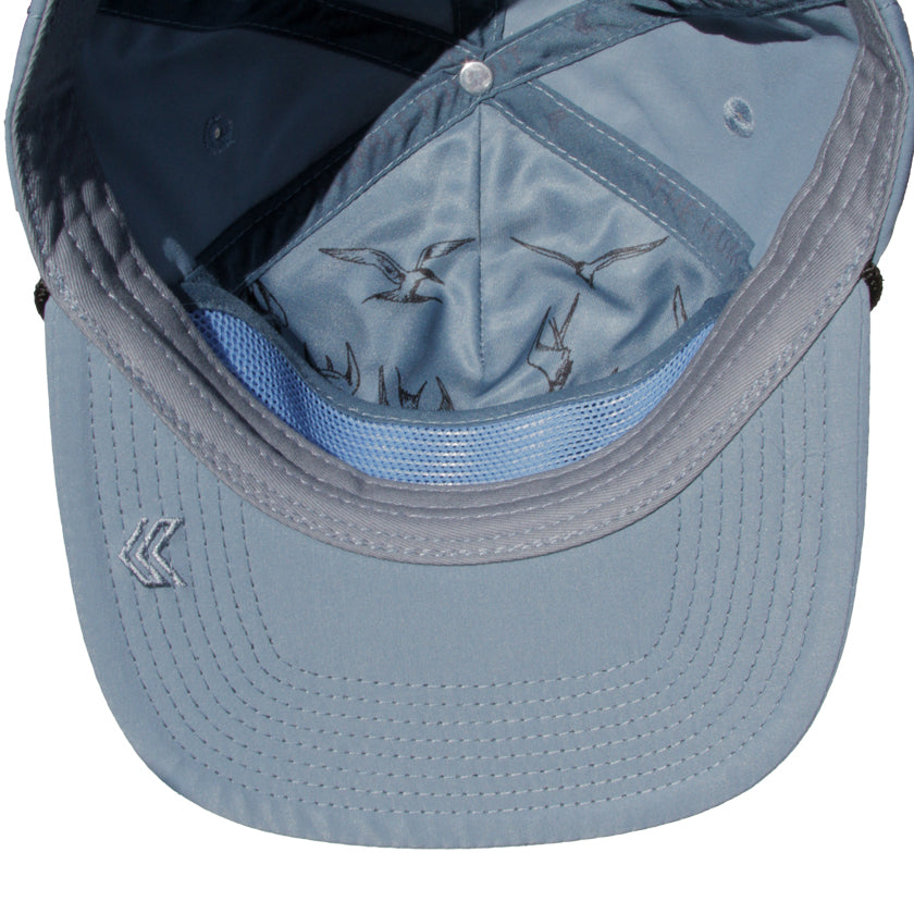 Blue Hat with Terns diving detail inside of hat. K logo bill embroidery.