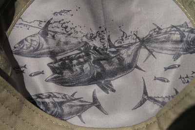 Tuna detail in black on inside of hat 