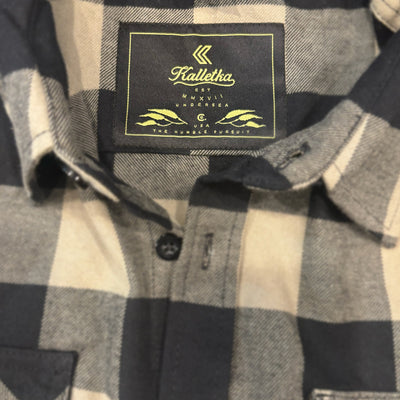 olive and black flannel tag detail 