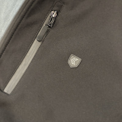 Close-up of a dark gray Gunnel Weather Tech Jacket with a zipper and a Kalletka logo on the chest.